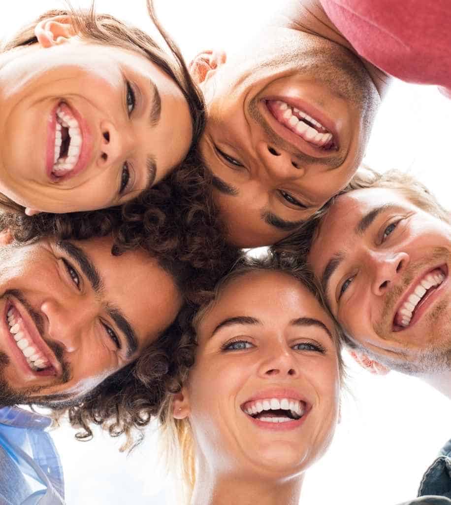 Smiling person showcasing white teeth after laser whitening treatment Gloucester