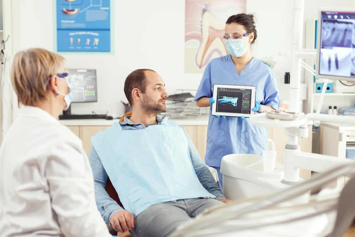 Laser teeth whitening treatment being applied by a dental professional Gloucester